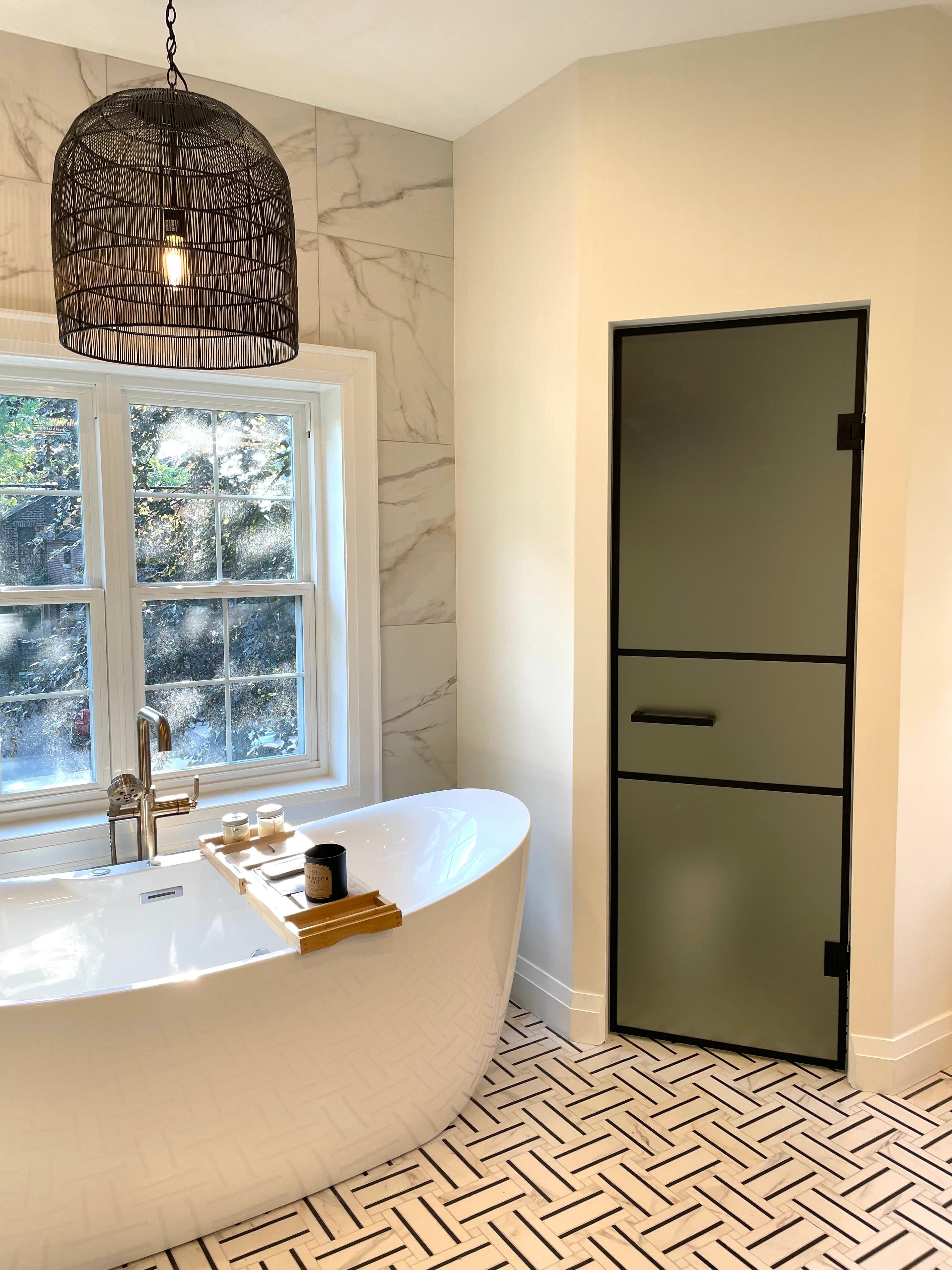 Spa-like bathroom renovation with luxury fixtures and elegant tile