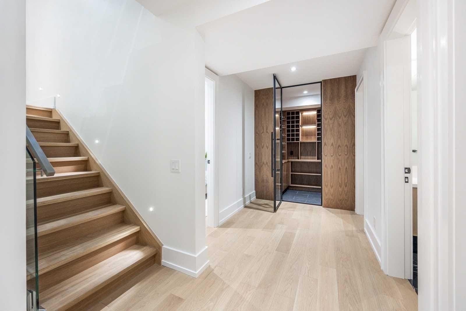 Hallway renovation with modern finishes and lighting