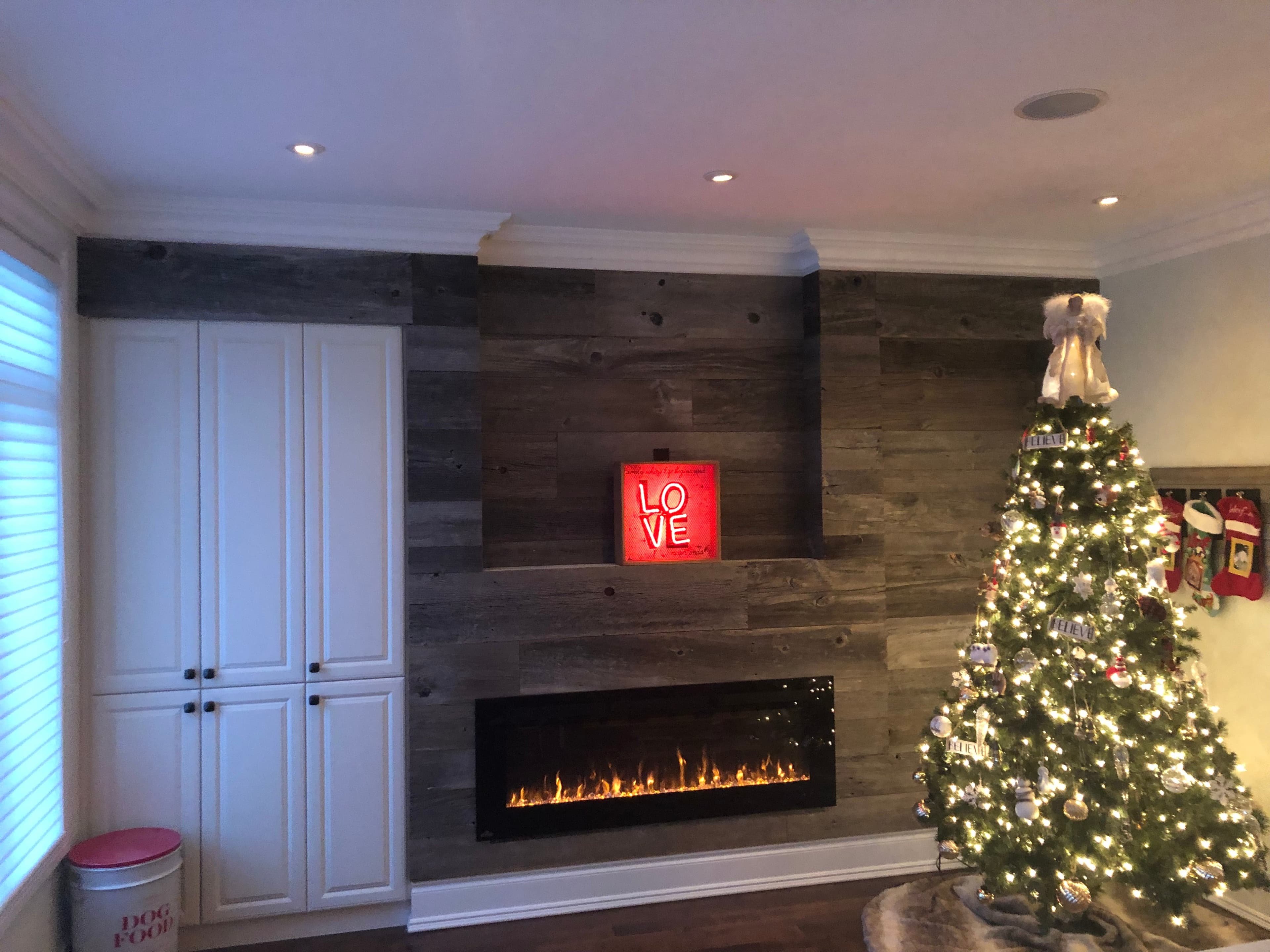 Contemporary living space remodel with custom built-ins and finishes