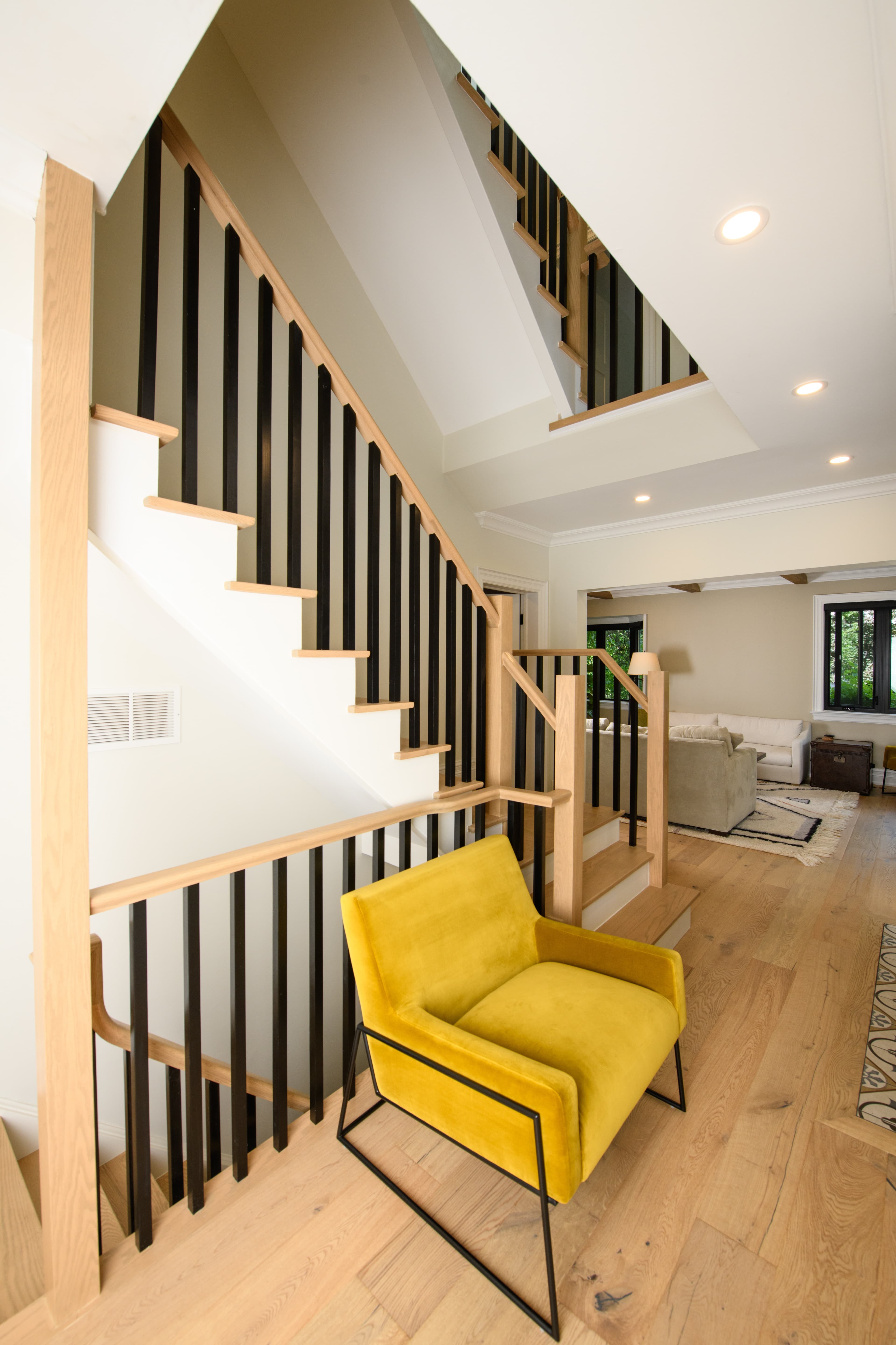 Stairway renovation featuring custom railings and finishes